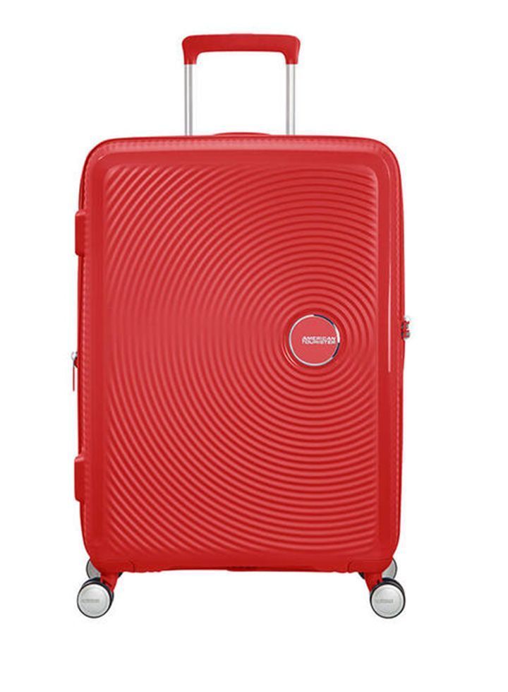 Maleta grande Soundbox American Tourister en color rojo, vista frontal, carcasa rígida, ruedas 360° y diseño resistente