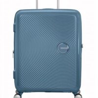 Maleta grande Soundbox American Tourister en color azul claro, vista frontal, carcasa rígida, ruedas 360° y diseño resistente